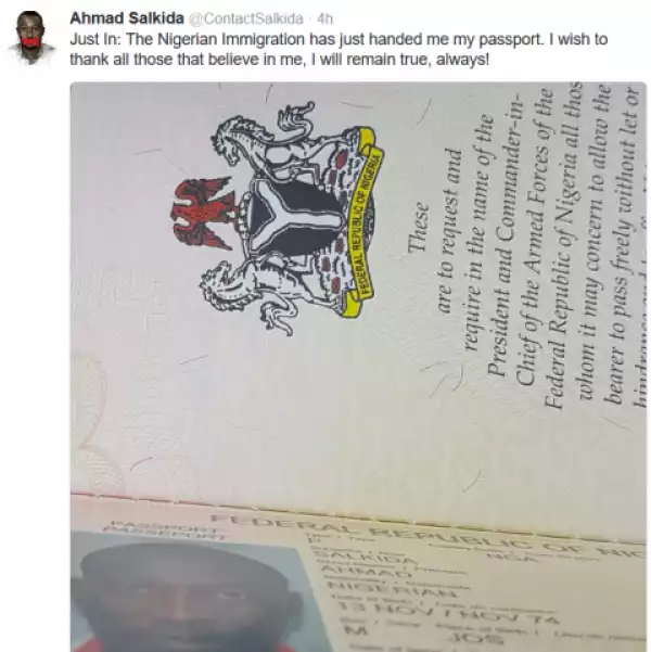 Ahmad Salkida gets his passport back from Nigerian immigration